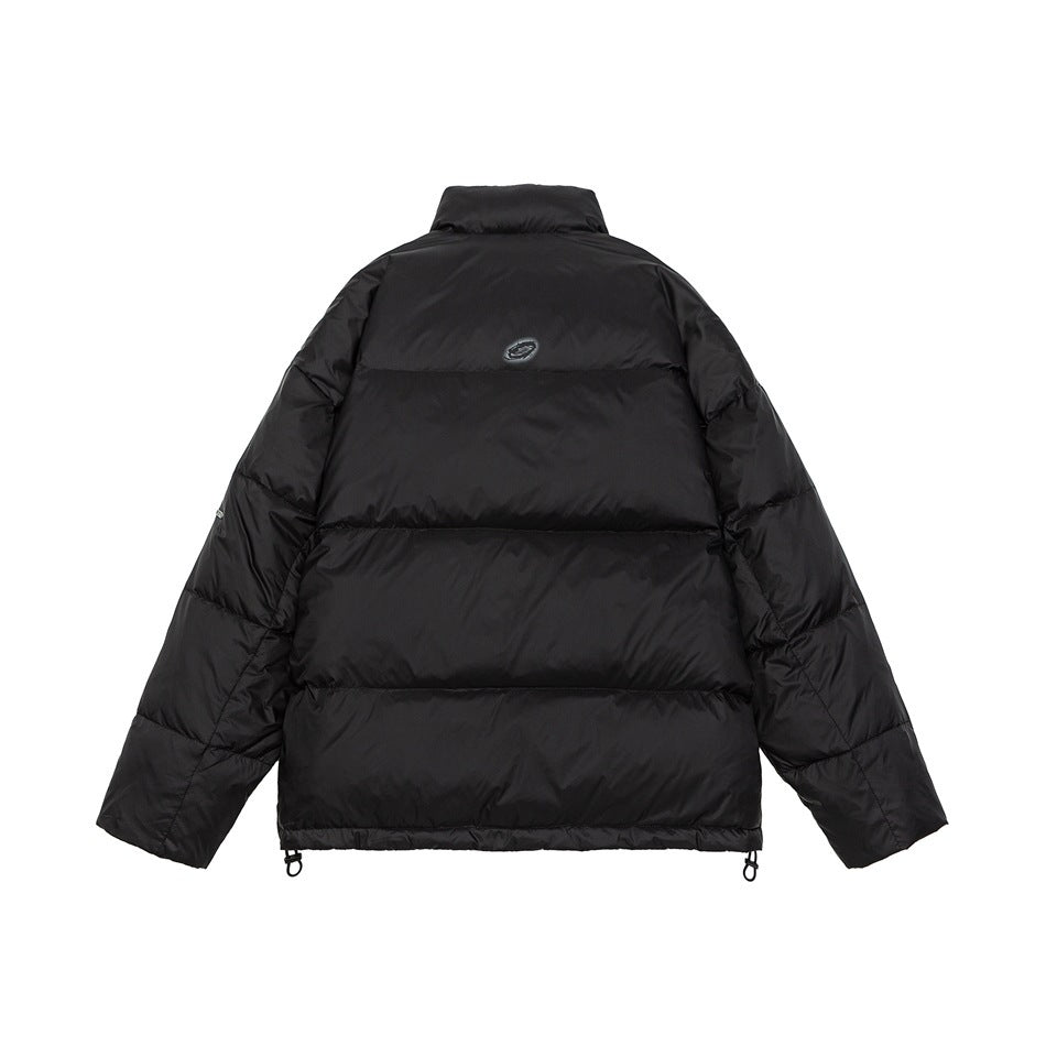Back view of a black quilted puffer jacket with a high collar, horizontal baffles, and hem adjusters.