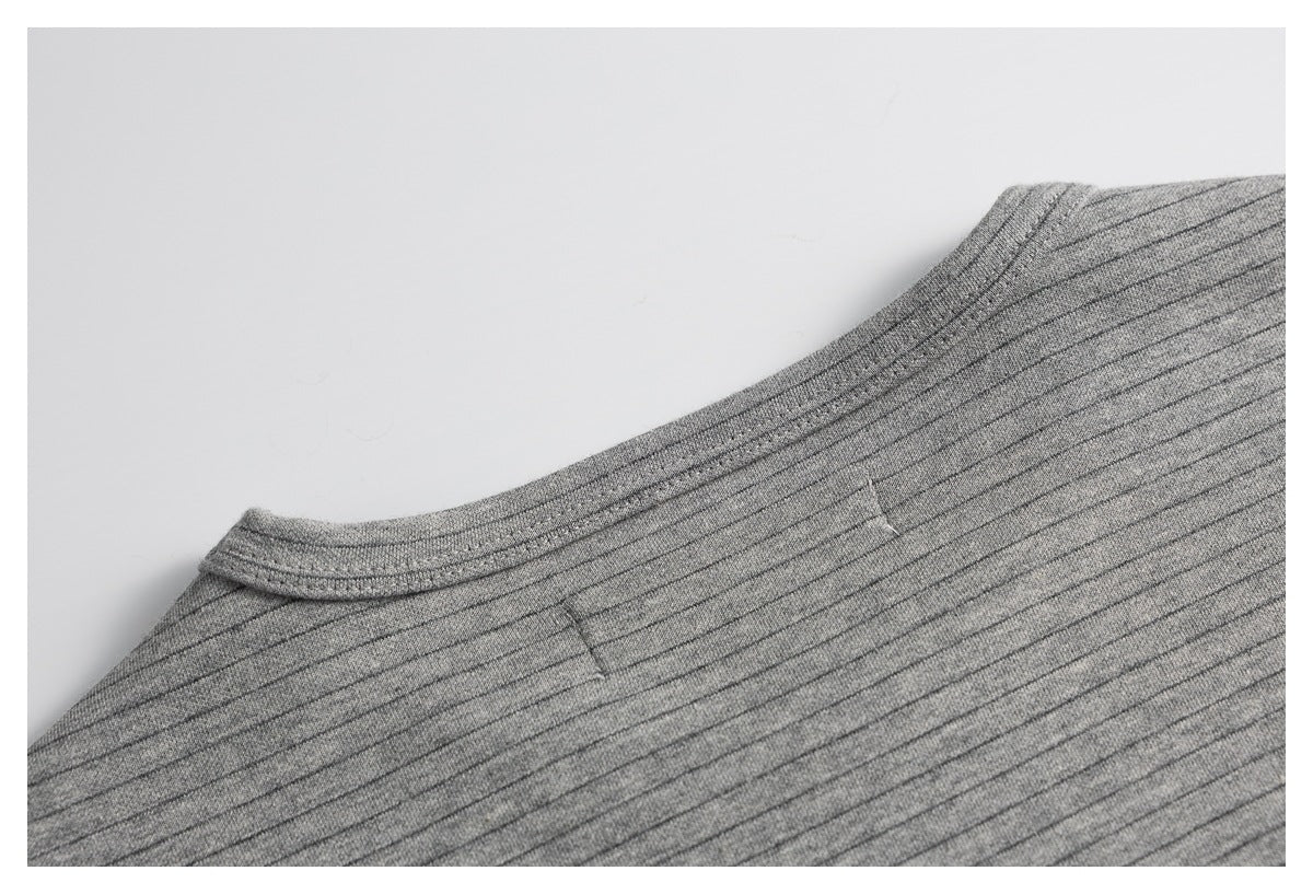 Close-up of the back neckline seam on a gray shirt with fine dark pinstripes.