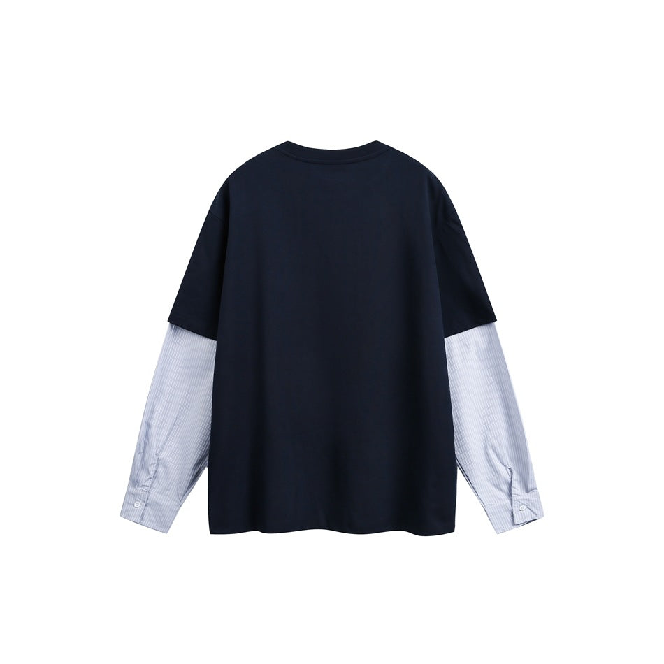 Back view of navy crew-neck top with light blue pinstriped sleeves and button cuffs, flat lay
