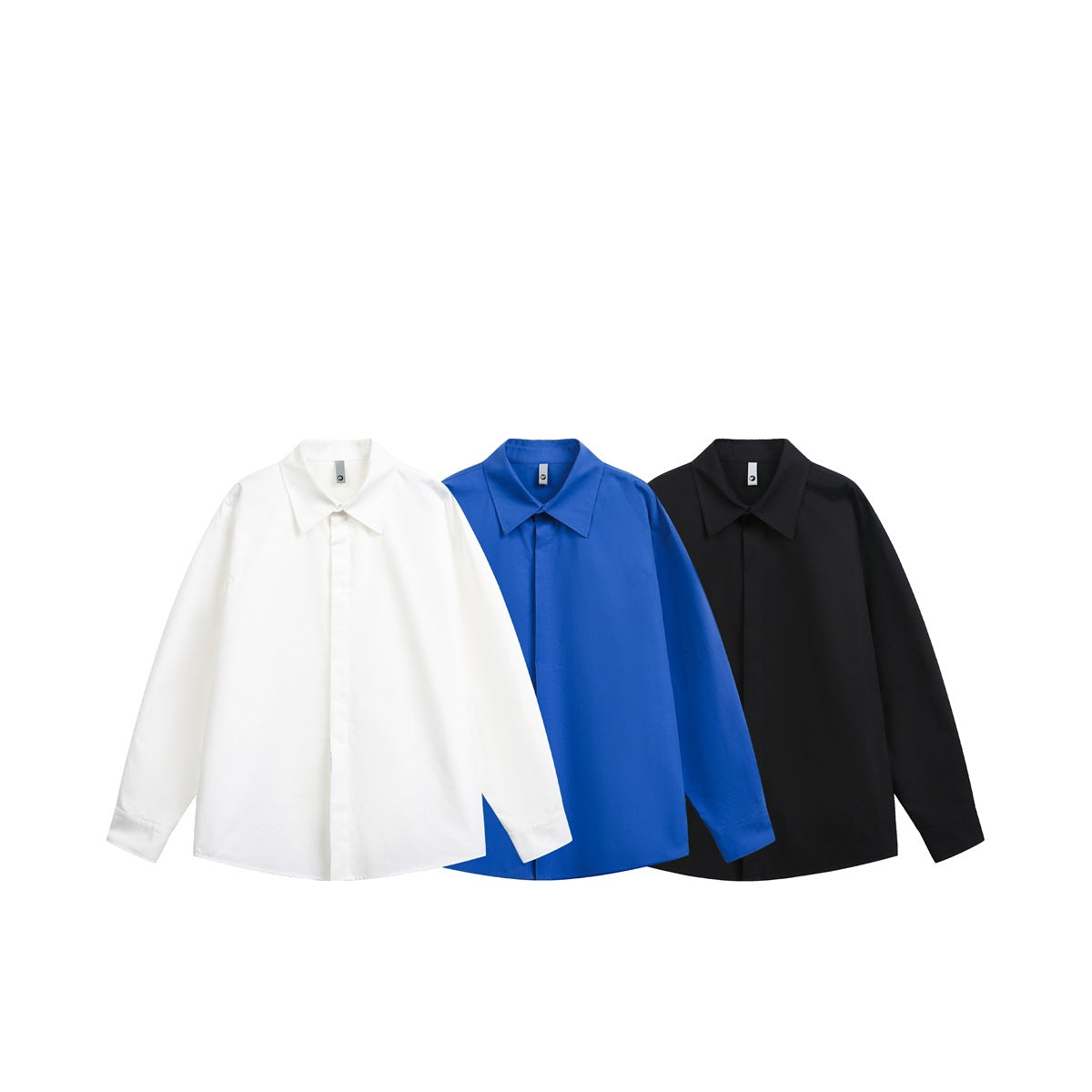 Three long-sleeve collared shirts shown from the front in white, royal blue, and black.