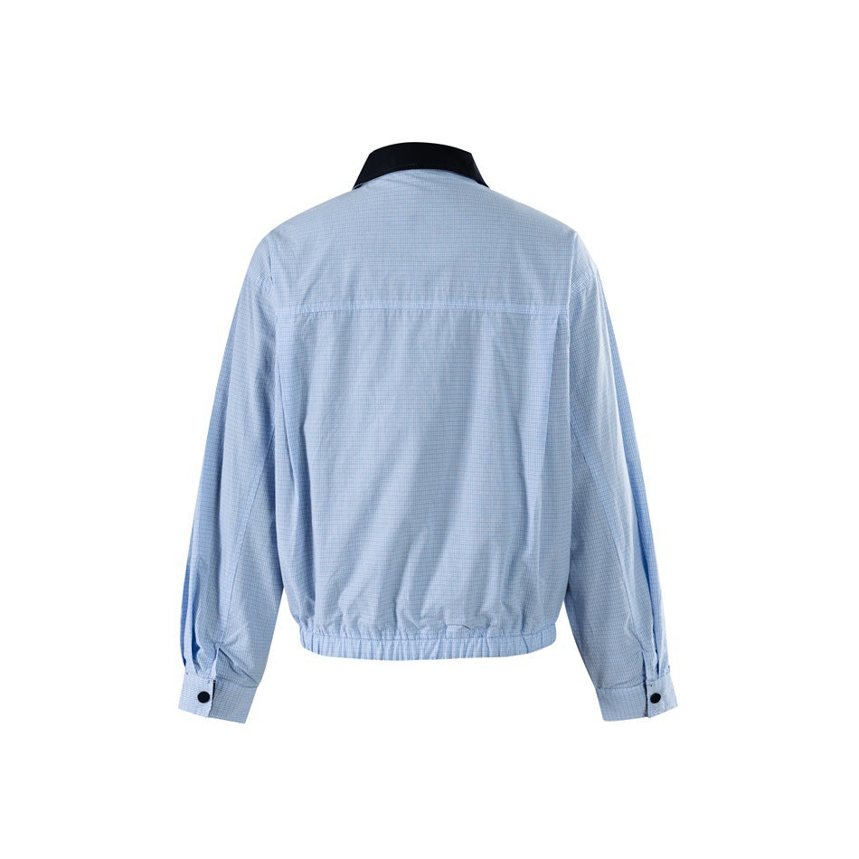 Back view of a light blue checked jacket with a black collar, button cuffs, and gathered hem.