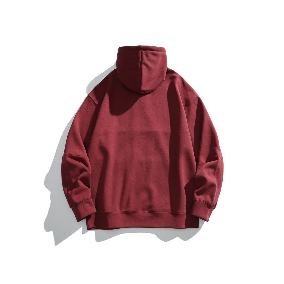 Back view of a burgundy hooded sweatshirt displayed against a white background.