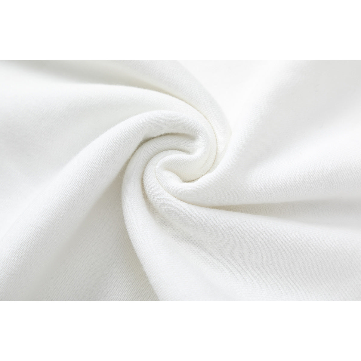 Close-up of white fabric gathered into a spiral fold.