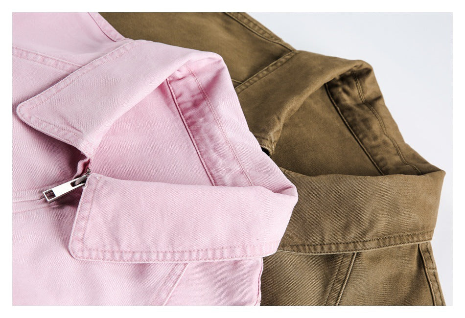 Close-up of pink and brown jackets showing their pointed collars, stitching, and metal front zippers.