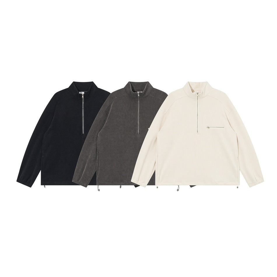 Three front views of a stand-collar quarter-zip jacket in black, charcoal gray, and ivory.