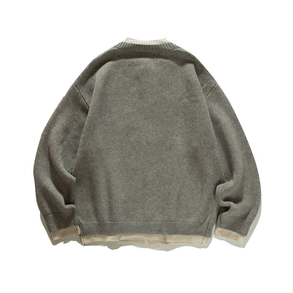 Back view of a gray knit cardigan with long sleeves and cream accents at the collar, cuffs, and hem.