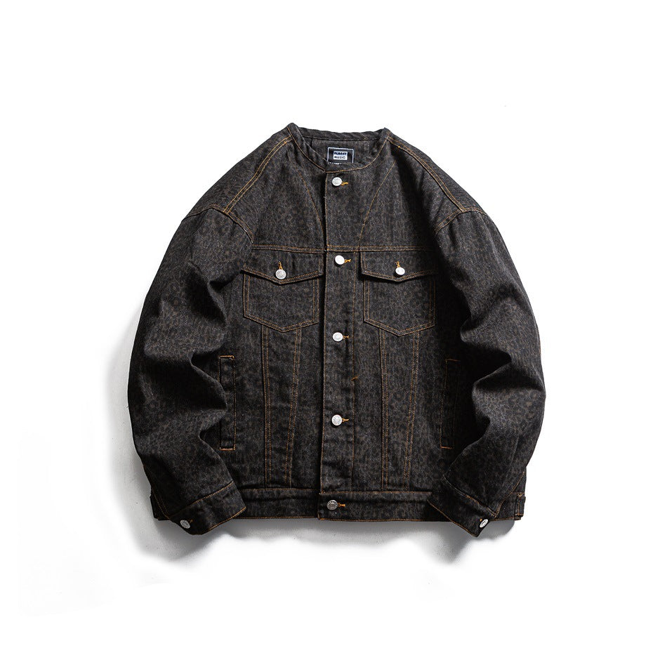 Black leopard-print denim-style collarless jacket, front view with flap pockets and gold topstitching