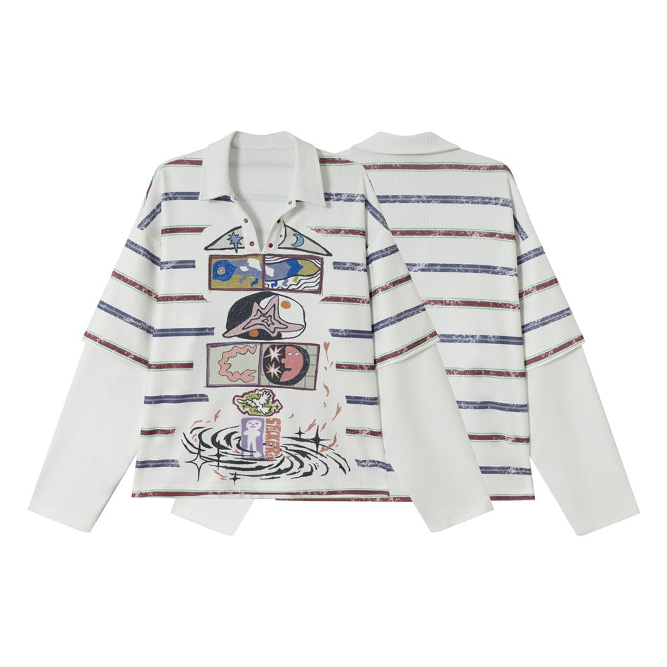 White collared polo with long layered sleeves, multicolor horizontal stripes, and large playful front graphics; front and
