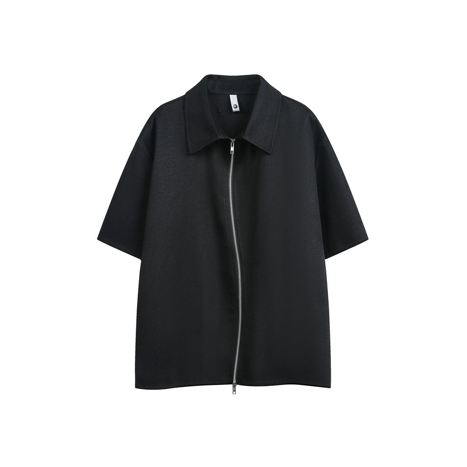 Black short-sleeve shirt with pointed collar and curved silver zipper down the front, flat view