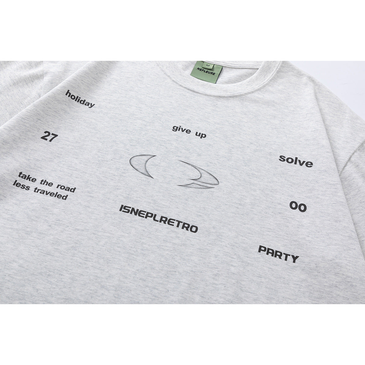 Close-up of a light heather gray T-shirt chest with black text and a central abstract graphic.