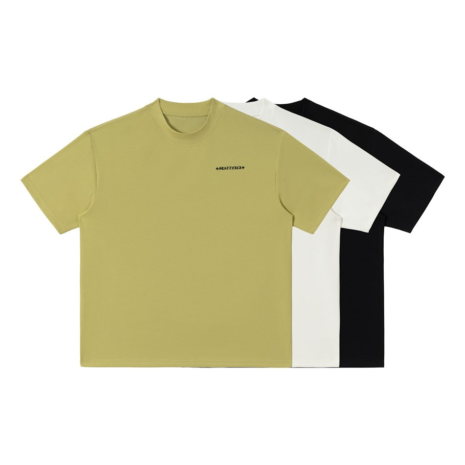 Three short-sleeve crew-neck T-shirts shown together in muted olive-yellow, white, and black.