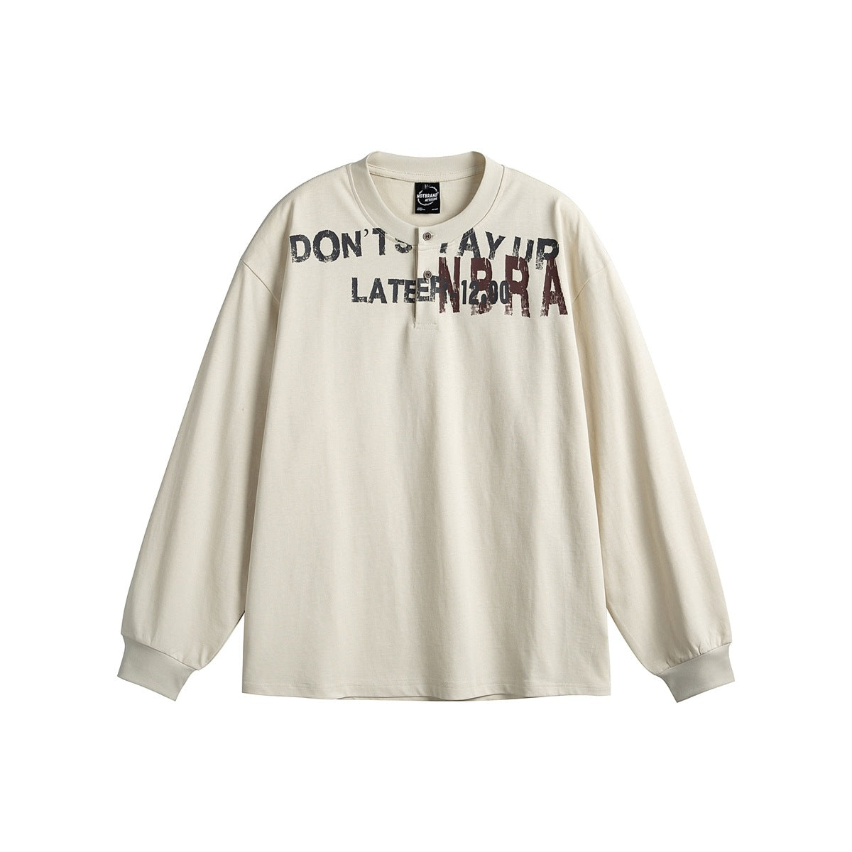 Beige long-sleeve Henley tee with button placket, ribbed cuffs and distressed lettering print across the chest, flat lay