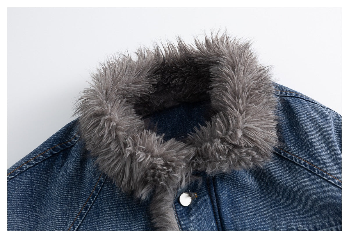 Close-up of a blue denim jacket's wide, shaggy gray collar and upper front snap.