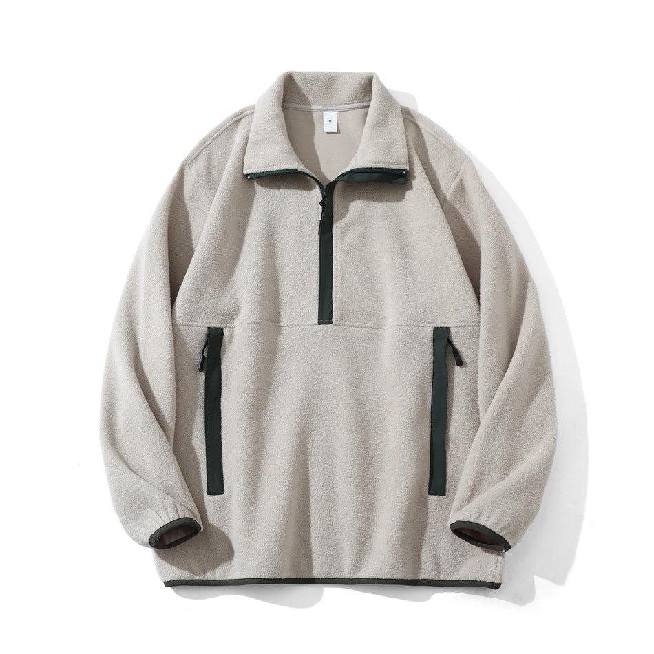 Beige fleece-like half-zip pullover with dark green trim on placket, pockets, cuffs and hem, flat lay front view