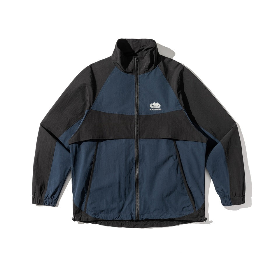 Navy and black color-block zip jacket with stand collar, raglan sleeves, and elastic cuffs, flat front view