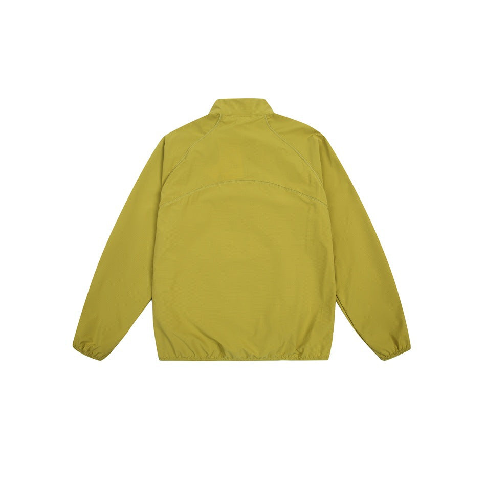 Back view of a mustard yellow long-sleeve jacket with a stand collar, curved seams and elastic cuffs and hem.