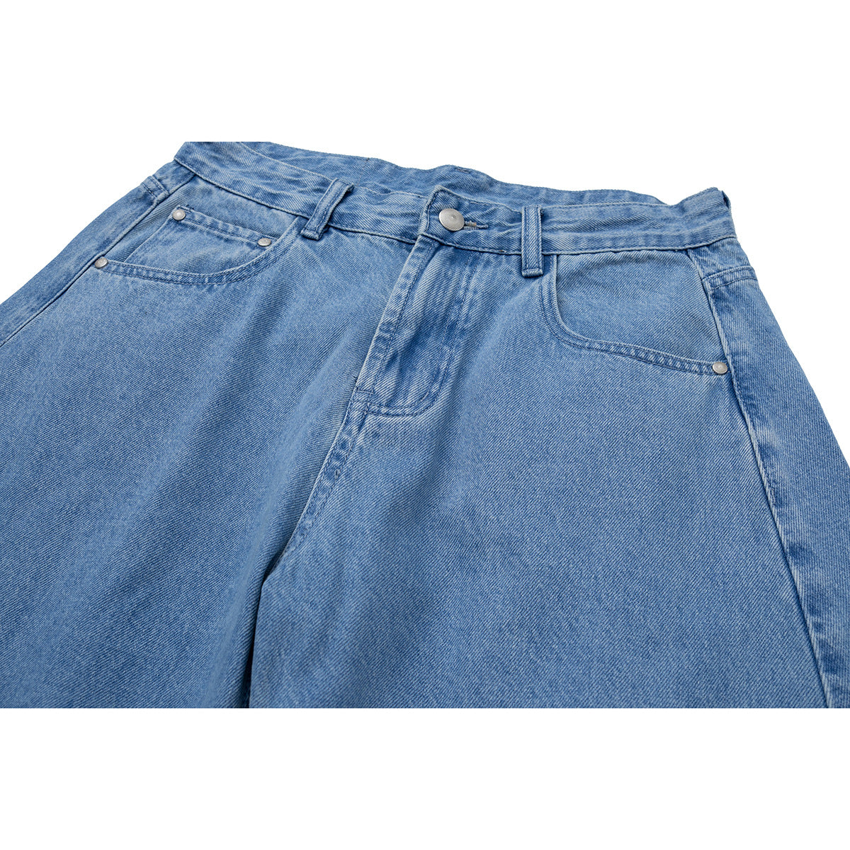 Close-up of light blue jeans showing the waistband, button, fly, belt loops, and front pockets.