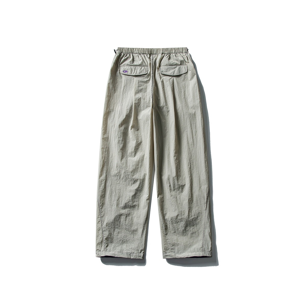 Light gray wide-leg pants with an elastic waist and two flap back pockets, shown from behind.