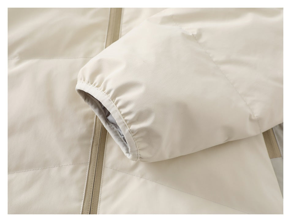 Close-up of a cream jacket sleeve with a gathered cuff and light lining.