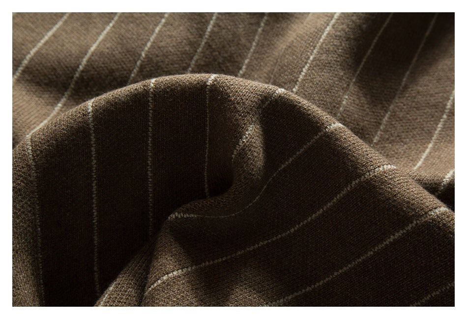 Close-up of draped brown striped cardigan knit with a folded ribbed edge.