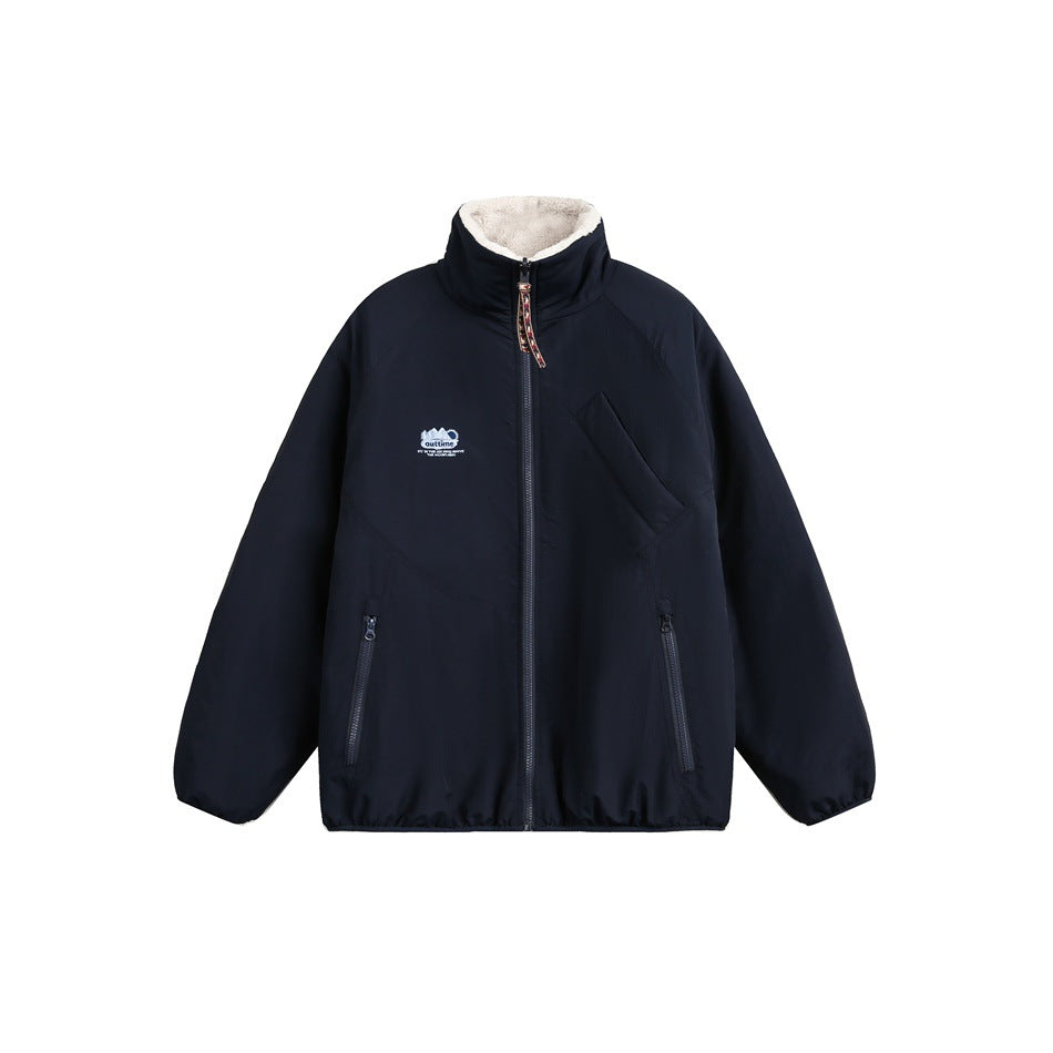 Navy zip-front jacket with a cream-lined stand collar, two zip pockets, and a small chest emblem.