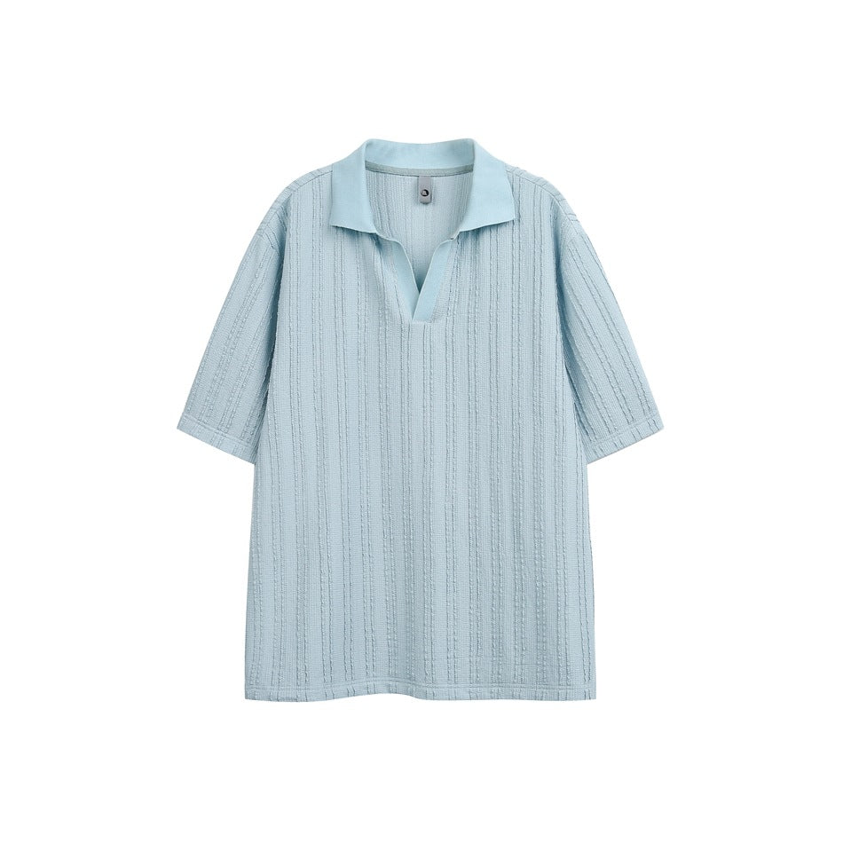 Sky blue short-sleeve polo-style top with textured vertical stripes and open V-neck collar, flat lay