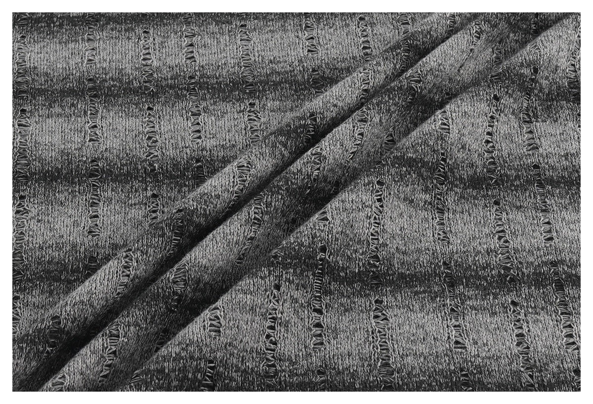 Close-up of the gray-and-black top's repeating textured pattern, draped diagonally.