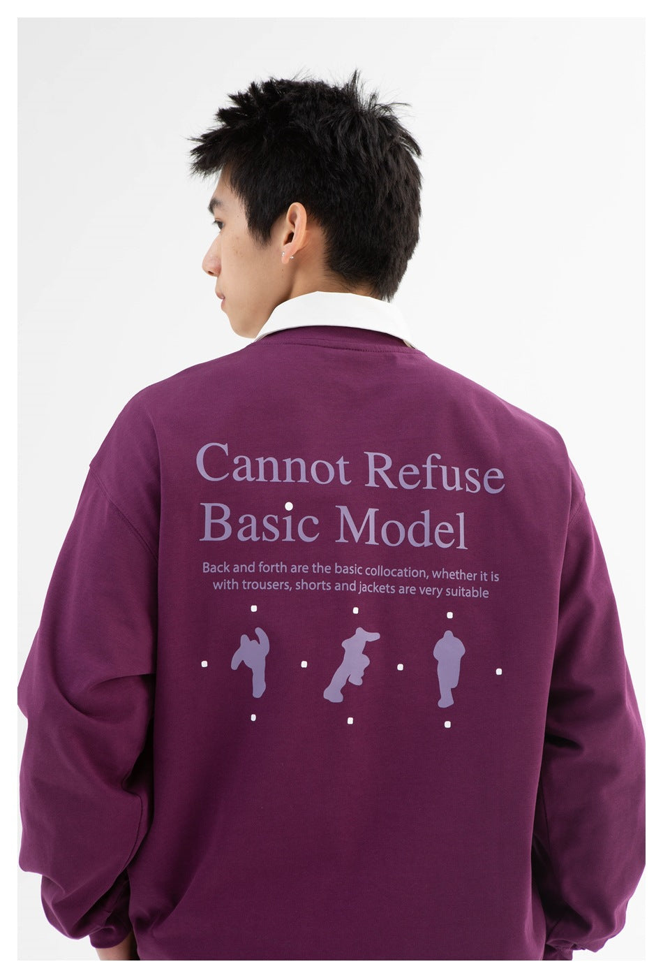 Back view of a model wearing a plum oversized sweatshirt with a white collar and large English text and graphic on the back.