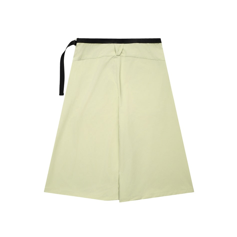 Pale yellow A-line wrap skirt shown flat, with a black waistband and long side tie.
