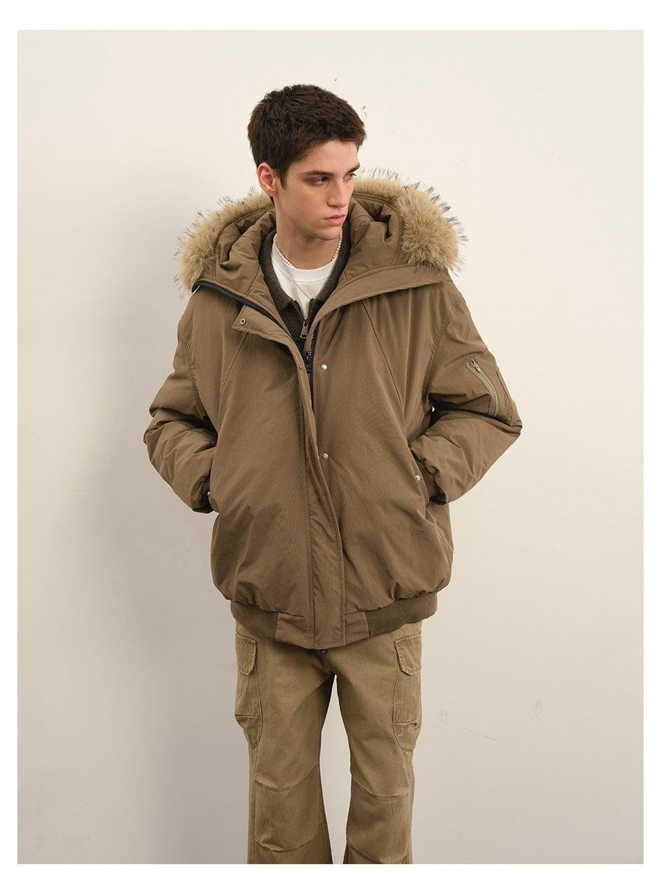Closer view of a model in a taupe padded jacket with a beige fur-trimmed hood and tan cargo trousers.