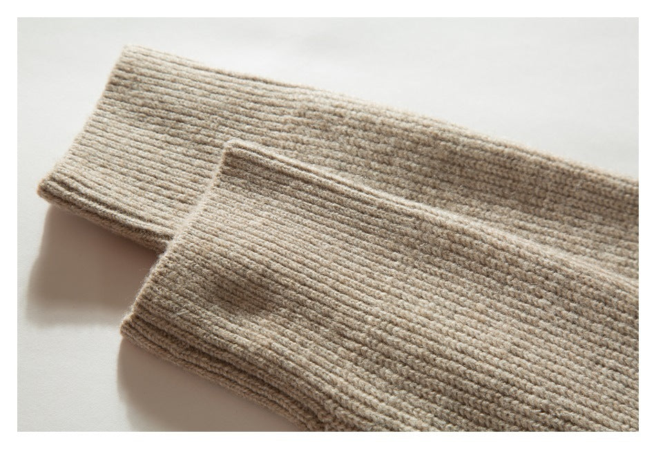 Two beige rib-knit sweater cuffs overlap on a white background.