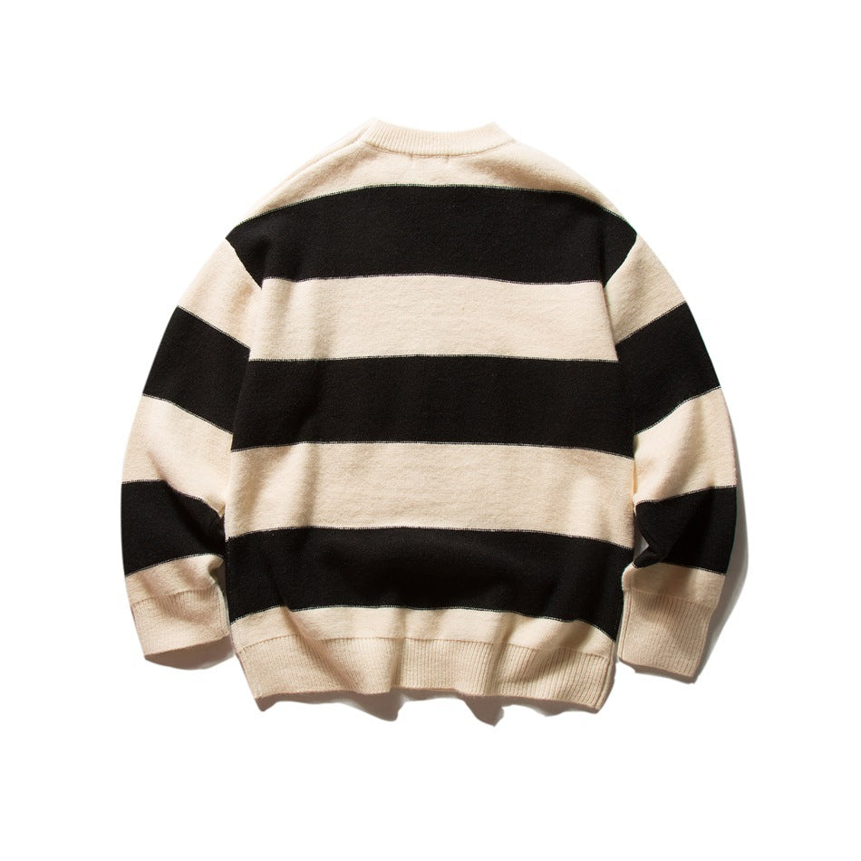 Black and cream wide-striped knit sweater laid flat, back view