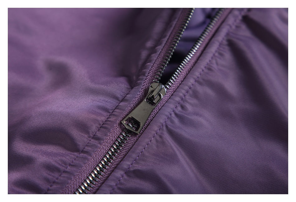 Close-up of the purple jacket's metal front zipper and pull.