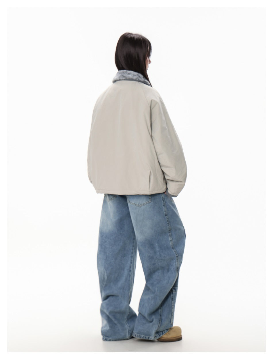 Side-rear view of a model wearing the light gray jacket with a plush gray collar.