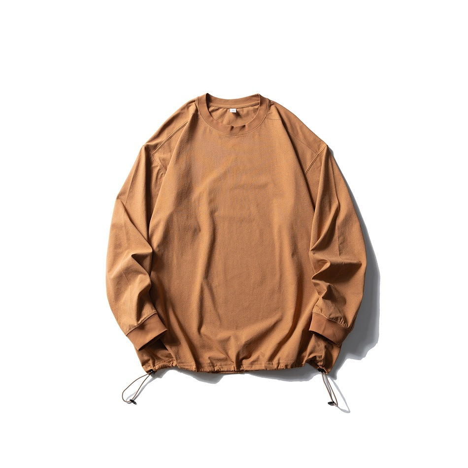 Caramel orange-brown long-sleeve crew-neck top flat lay with drawstring hem and toggle cords