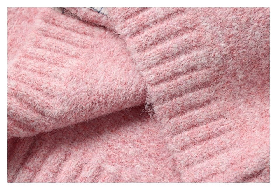 Close-up of fuzzy pink knit fabric folded into soft ridges.