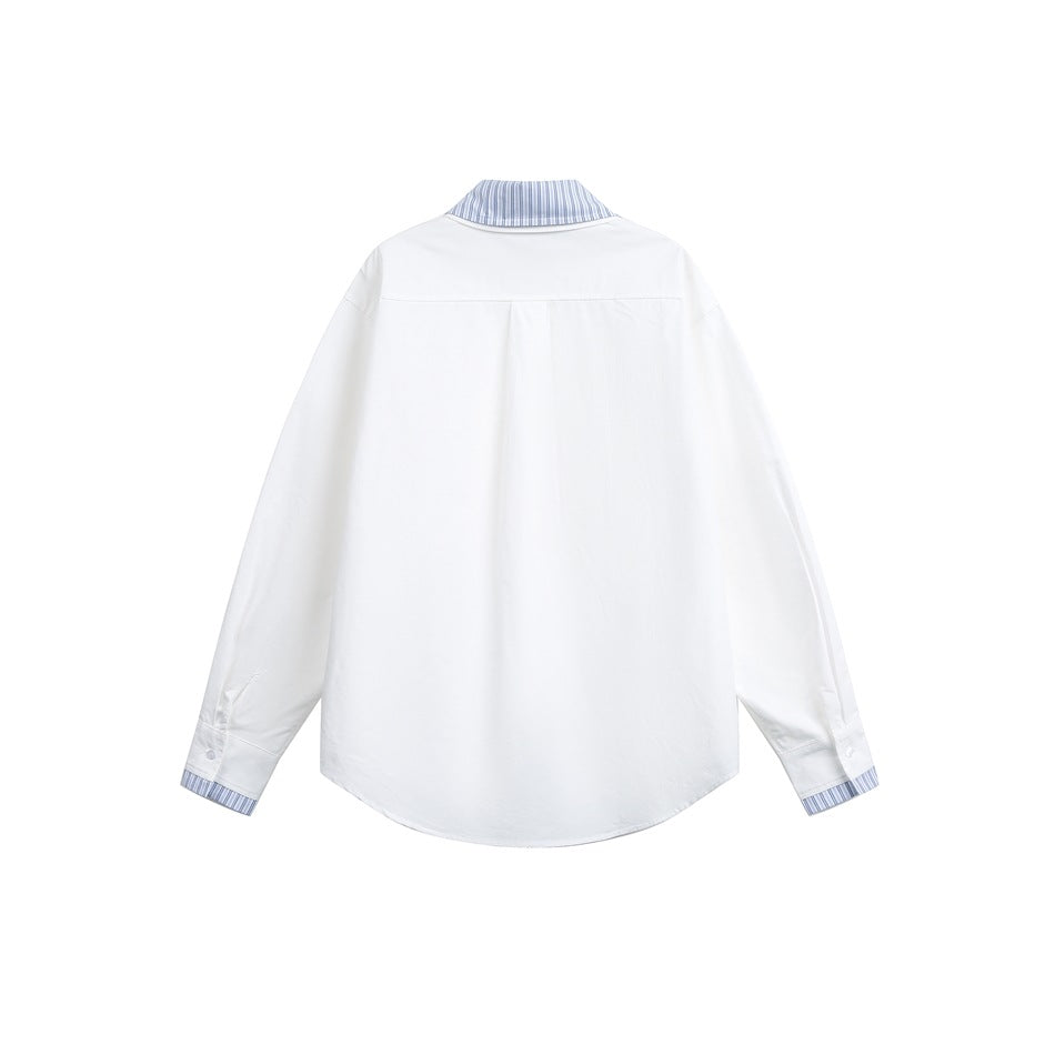 Back view of white long-sleeve shirt with striped collar lining, yoke seam, striped cuff trim and curved hem