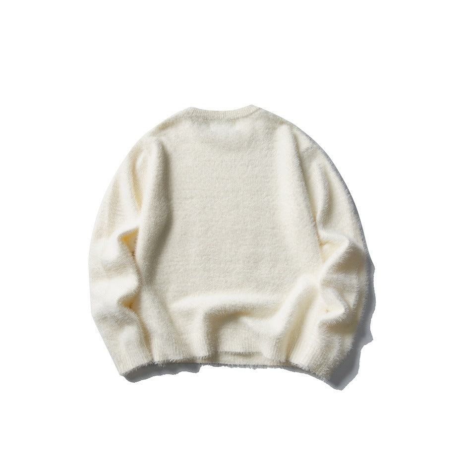 Back view of an ivory crew-neck sweater with long sleeves and ribbed cuffs and hem, laid flat.