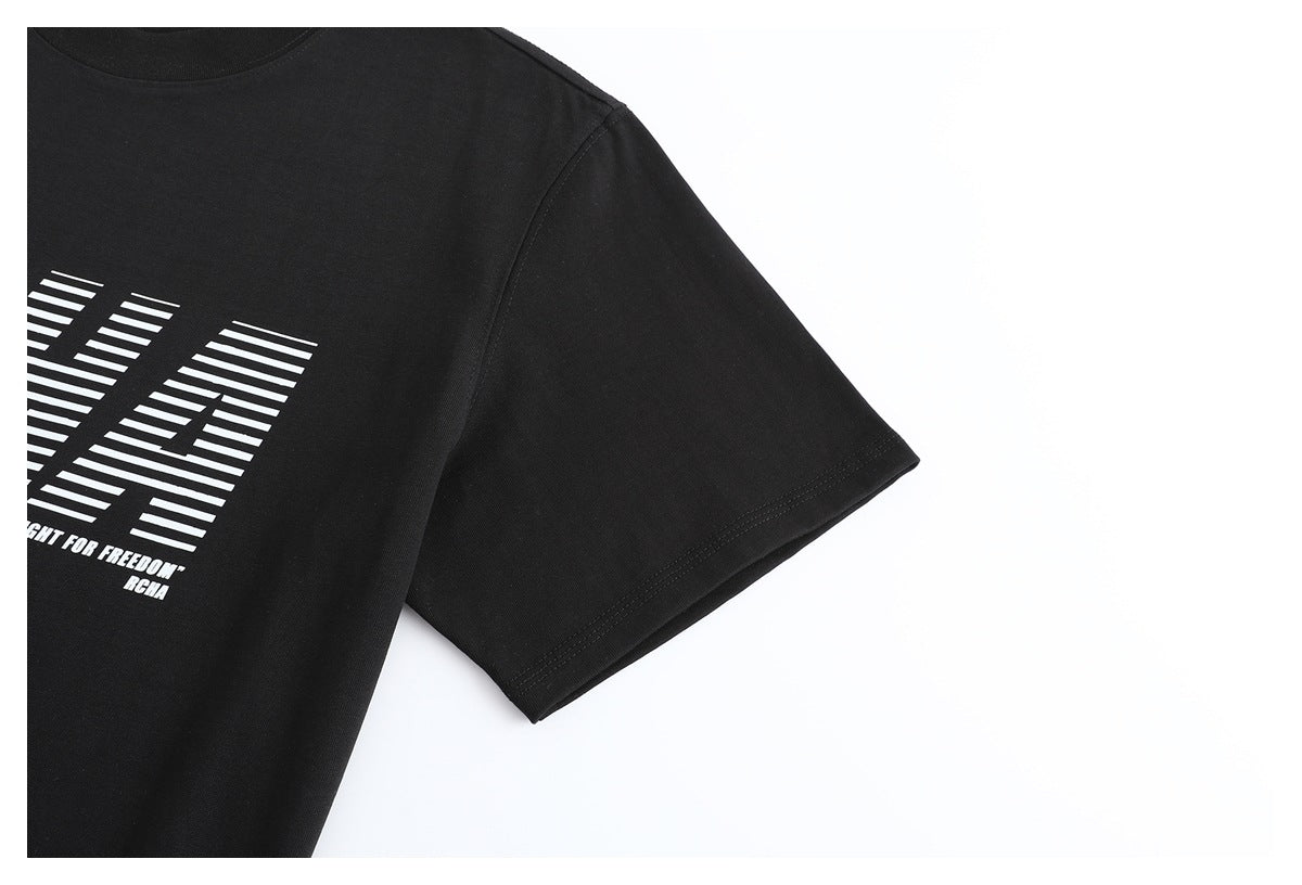 Close-up of a black T-shirt sleeve and part of its white striped front graphic.