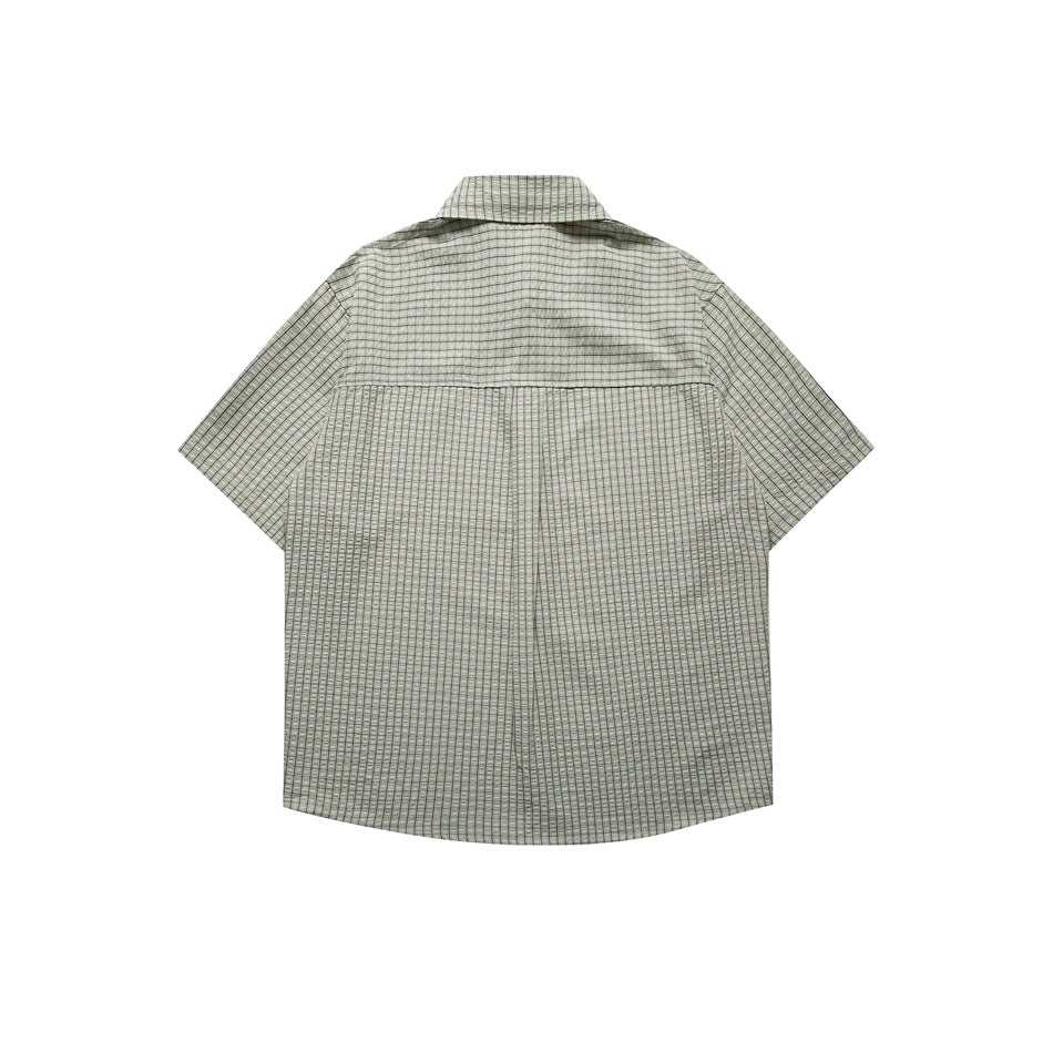Back view of light green checked short-sleeve shirt showing yoke seam and curved hem