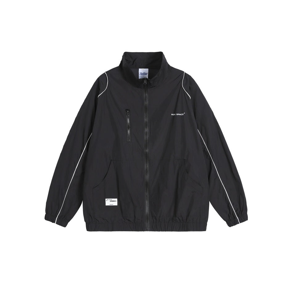Black stand-collar full-zip jacket with white piping, zippered chest pocket and elastic cuffs, flat front view