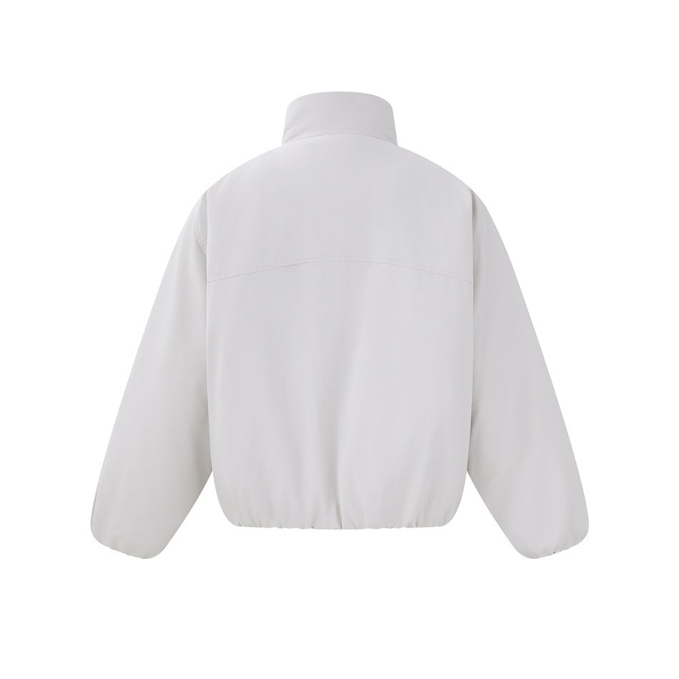 Back view of a white jacket with a tall collar, curved shoulder seam, and gathered hem.
