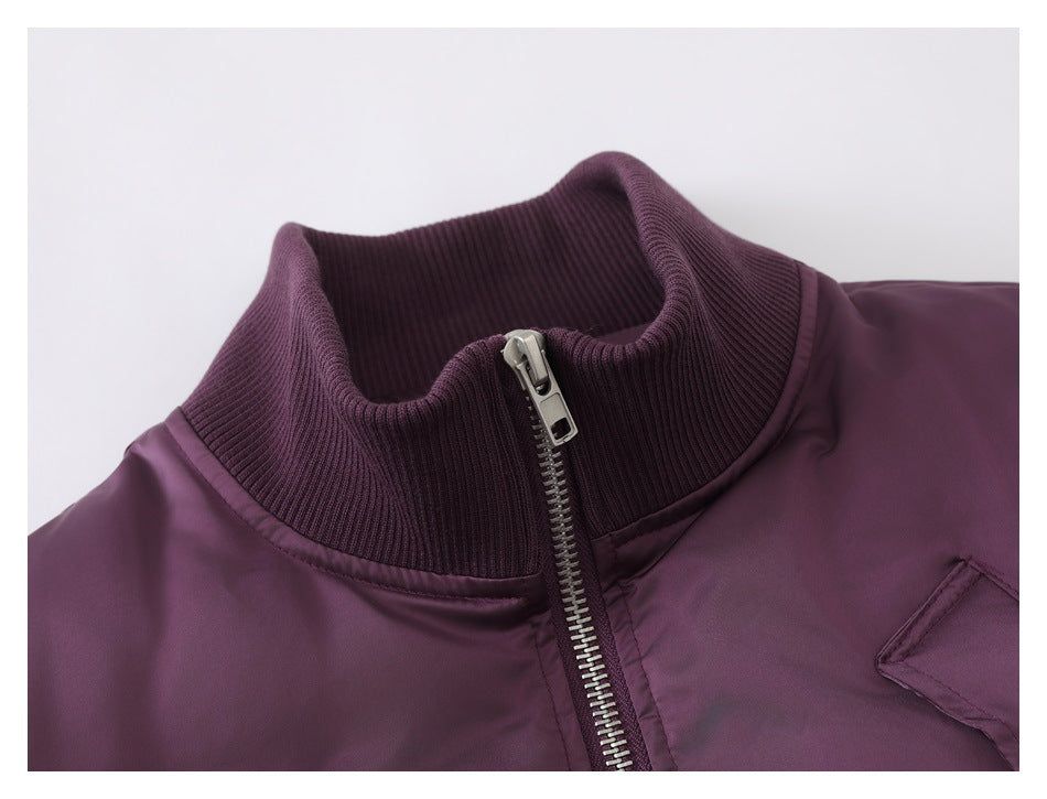 Close-up of the jacket's ribbed high collar and silver front zipper.