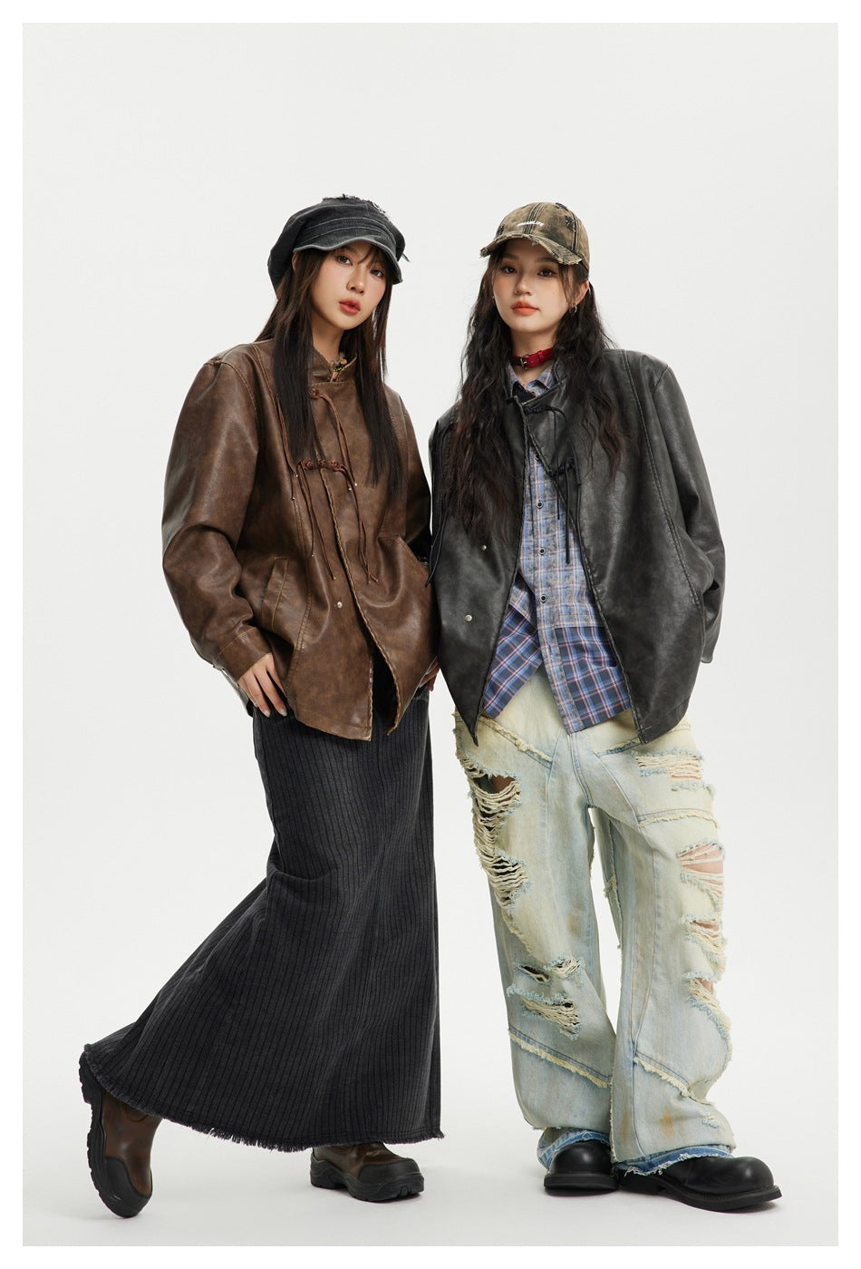 Two models show oversized jackets in brown and charcoal black, styled with contrasting skirts and distressed jeans.