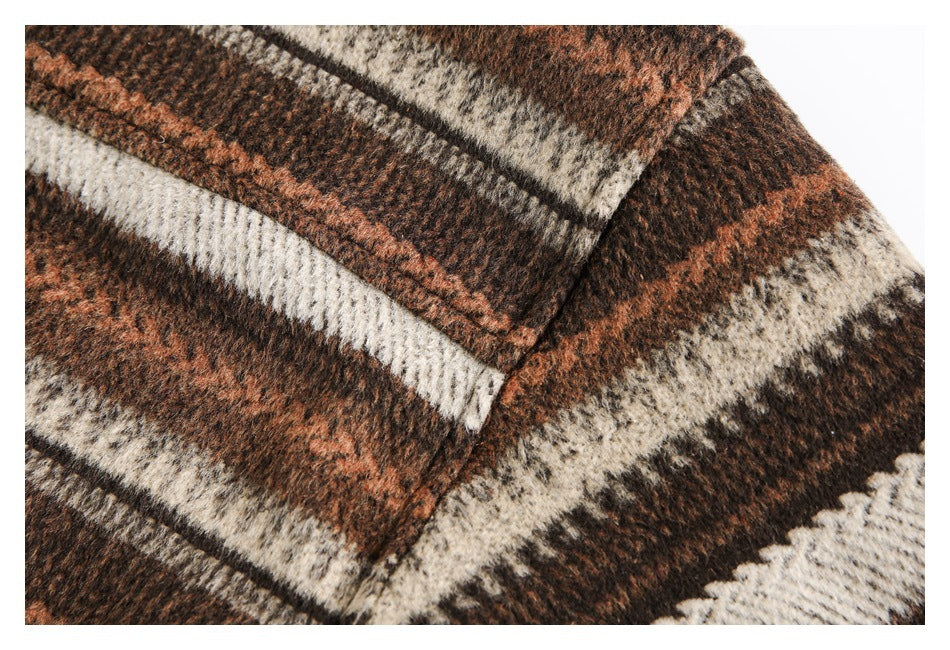 Close-up of a plaid chest pocket with a pointed flap and matching stitching.