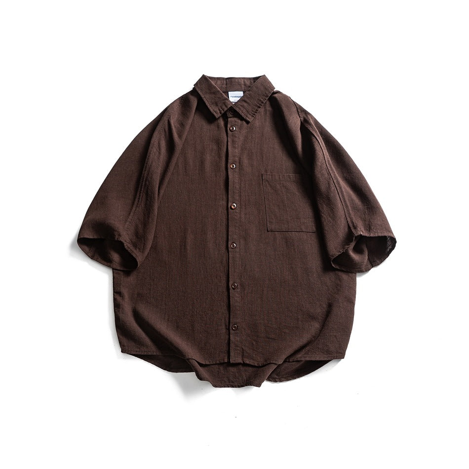 Brown short-sleeve button-front shirt with collar and chest pocket, flat lay front view