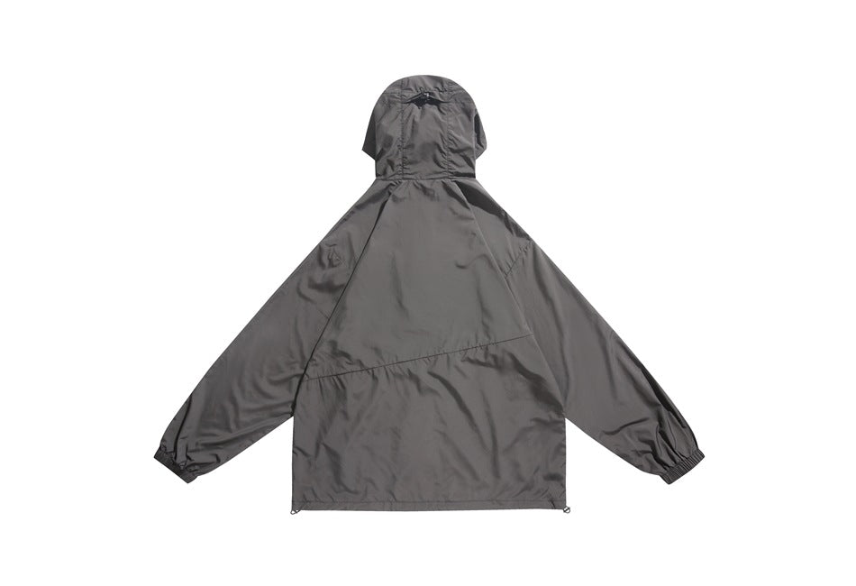 Back view of a gray hooded jacket with raglan sleeves, elastic cuffs, and an adjustable hem.