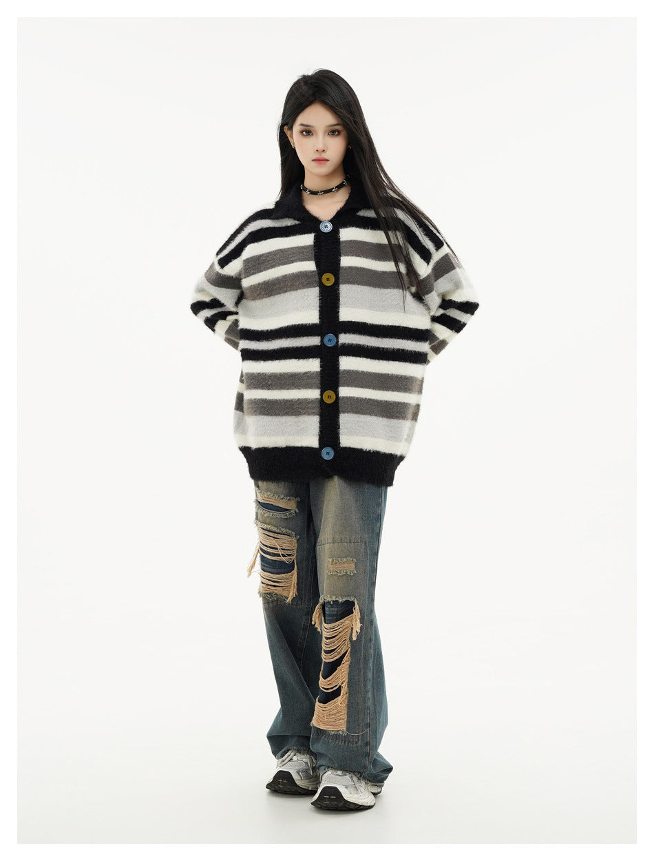 Model wearing a black, gray, and cream striped button-front cardigan with distressed wide-leg jeans.