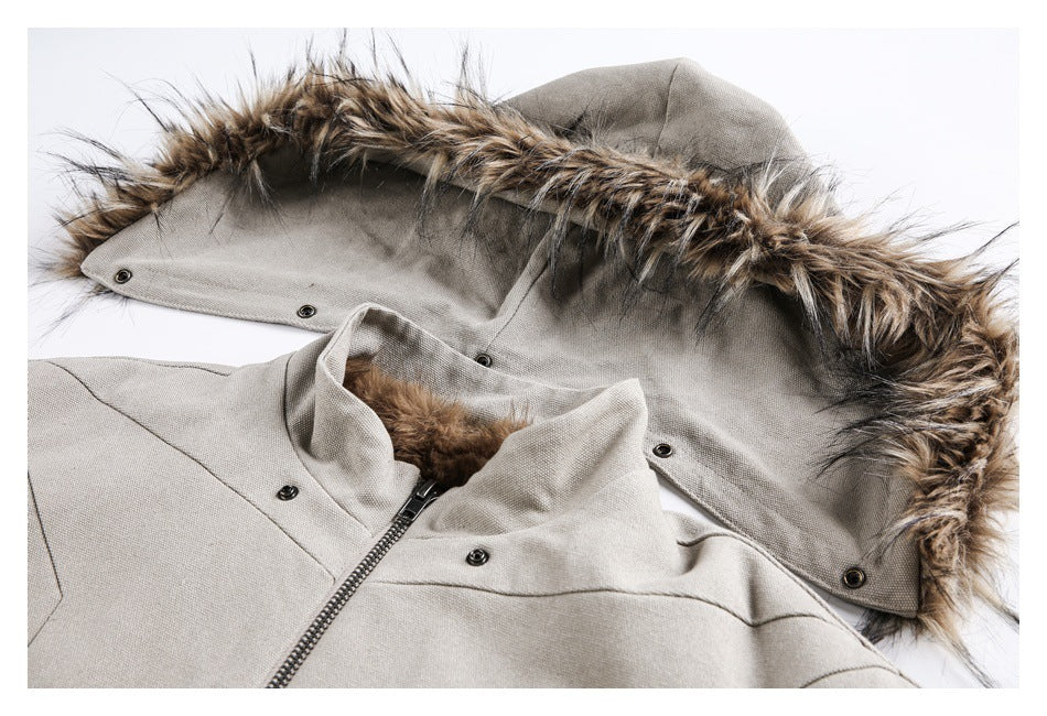 Close-up of a light taupe jacket hood trimmed with brown faux fur, with the front zipper and snaps visible.