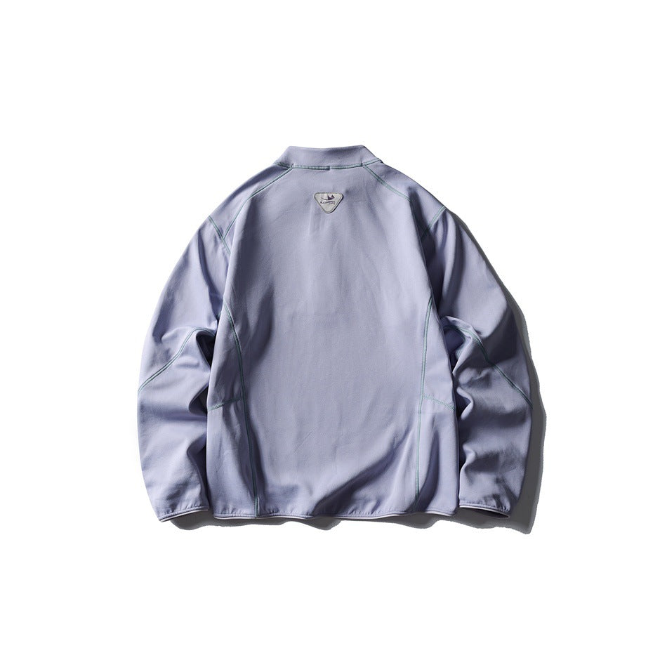 Back view of a pale lavender pullover with teal contrast seams and a small upper-back patch.